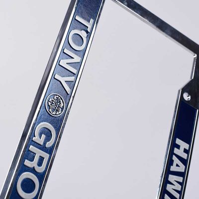 closeup back view of Chrome Faced Engraved License Frame