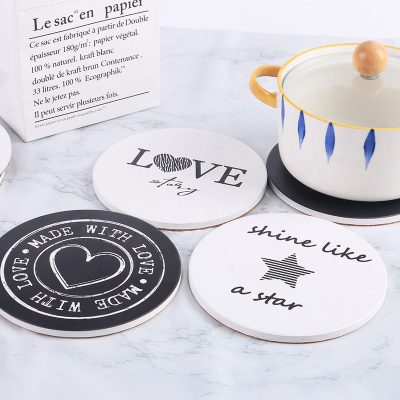 white and black ceramic coasters