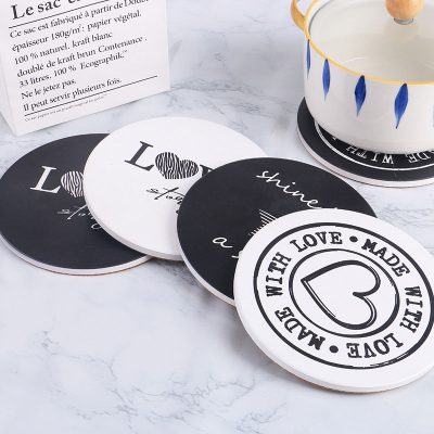 white and black ceramic coasters